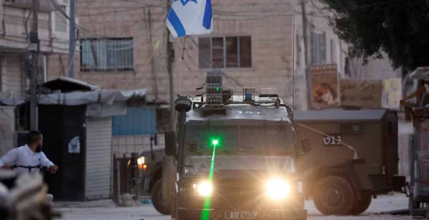 A military vehicle with a laser transits during an Israeli raid in Jenin, in the Israeli-occupied West Bank