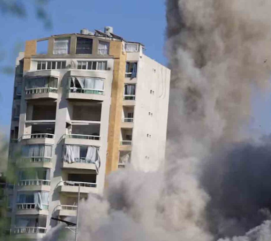 Smoke rises as a building collapses following a missile strike, amid ongoing hostilities between Hezbollah and Israeli forces, in Beirut's southern suburbs, Lebanon