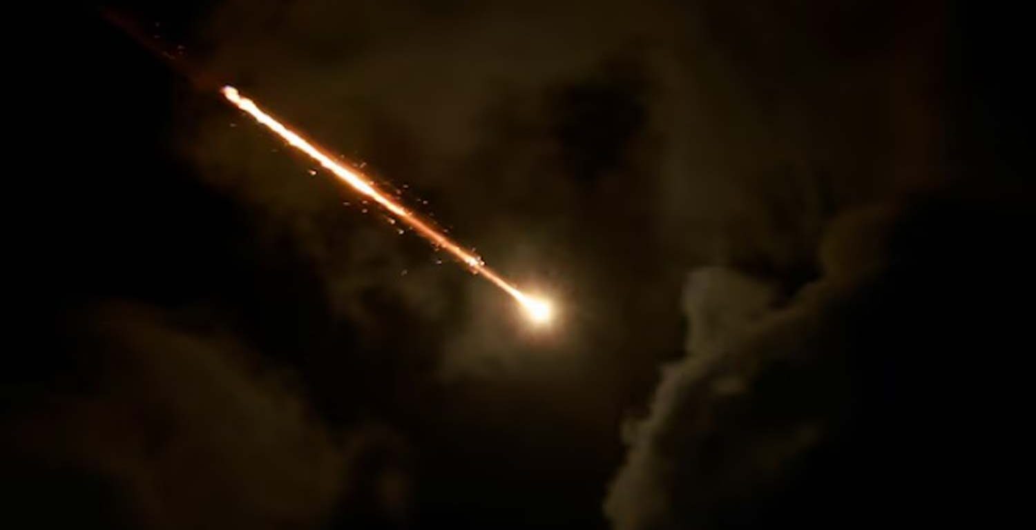 A projectile is seen in the sky after Iran fired a salvo of ballistic missiles, amid cross-border hostilities between Hezbollah and Israel, as seen from Tel Aviv, Israel