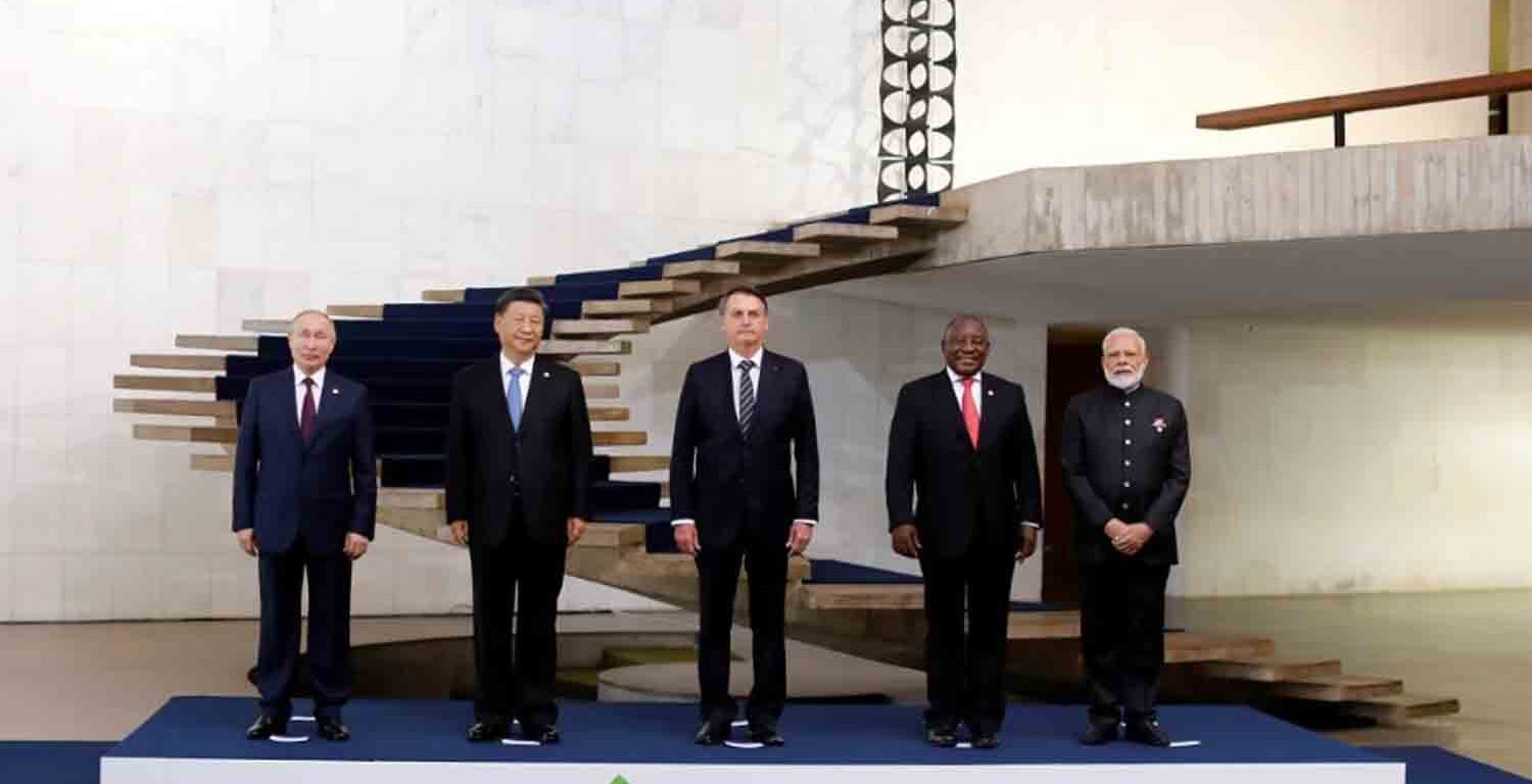 Russian President Vladimir Putin, Chinese leader Xi Jinping, then-Brazilian President Jair Bolsonaro, South African President Cyril Ramaphosa and Indian Prime Minister Narendra Modi pose as they arrive for the BRICS summit in Brasilia in November 2019.