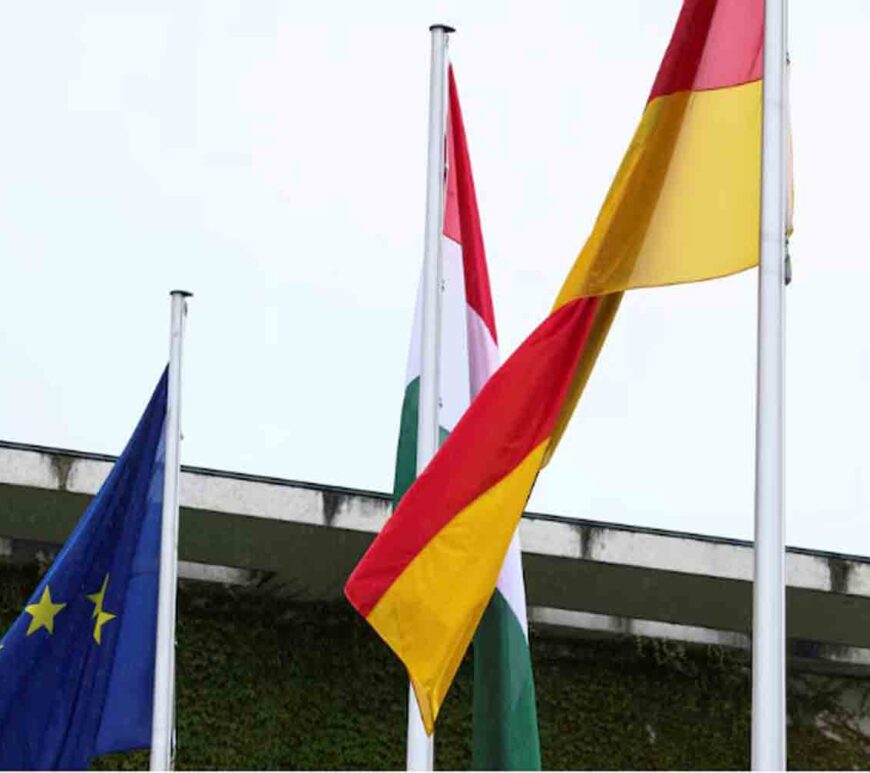 The flags of the European Union, Hungary and Germany fly outside Berlin's chancellery in Berlin, Germany