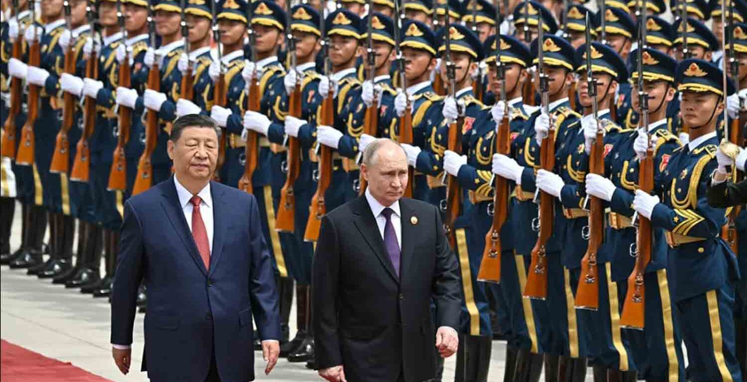 Russian President Vladimir Putin and Chinese leader Xi Jinping attend a welcoming ceremony in Beijing's Tiananmen Square during Putin's state visit.