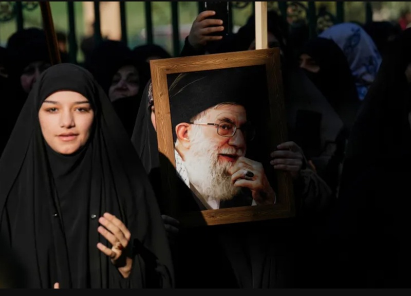 An Iraqi woman holds a portrait of Iran's Supreme Leader Ayatollah Ali Khamenei An Iraqi woman holds a portrait of Iran's Supreme Leader Ayatollah Ali Khamenei, in front of the Iranian embassy, during a rally to show solidarity with Iran and oppose US threats of a military strike, in Baghdad, Iraq, on Friday, January 16, 2026